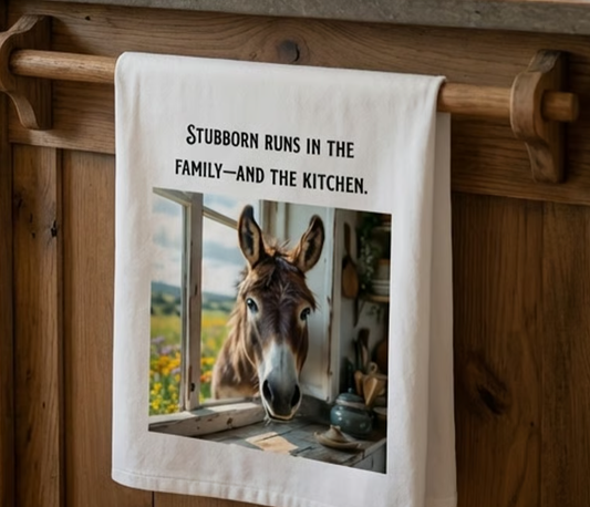 “Stubborn runs in the Family—and the Kitchen” Sassy Donkey themed tea towel.